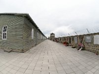 2019 - Feierlichkeiten zur 74. Wiederkehr der Befreiung des Konzentrationslagers Mauthausen, durch amerikanische Truppen  Feierlichkeiten zur 74. Wiederkehr der Befreiung des Konzentrationslagers Mauthausen, durch amerikanische Truppen. Dieses Bild zeigt einen Teil der Anlage der KZ Gedenkstätte Mauthausen mit der Galerie auf der Innenseite der Aussenmauer, mit diversen Gedenktaflen, unter denen am Gedenktag Blumengrüße deponiert sind. Auf der gegenüber liegenden Seite sind Wohnbaracken der damaligen Häftllinge zu sehen. Im Hintergrund befindet sich ein Wachturm. : #1B#, 74. Befreiungsfeier, 74. Gedenkfeier, Anlagenteil, BAuwerk, Befreiungsfeier, Blumengruesse, Blumengrüße, Blumenkraenze, Blumenkränze, Festungsanlage, Fischauge, Galerie, Gedenkfeier, Gedenktfeln, Geschichte, KZ, Konzentrationslager, Mauthausen, Wachturm, Weitwinkelaufnahme, Wohnbaracken, historisch